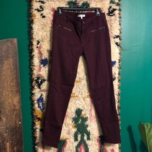 Burgundy jeans with zipper detail